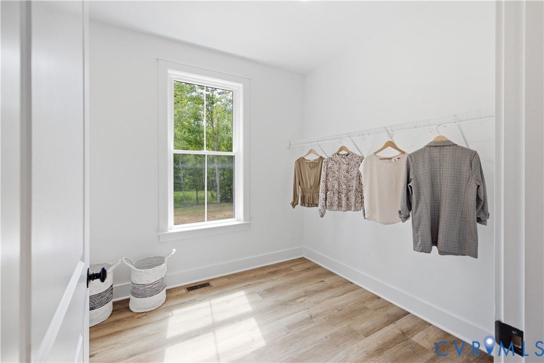 3120 Lake Stone (lot 22) Terrace, Maple Grove, Powhatan, VA 23139 Large walk-in closet. Photo of for-sale home, staged