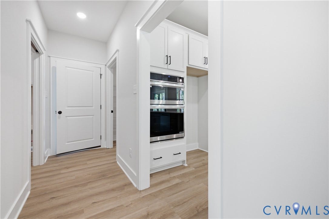 3120 Lake Stone (lot 22) Terrace, Maple Grove, Powhatan, VA 23139 Hall off kitchen to large pantry, garage, laundry room. Photo of for-sale home