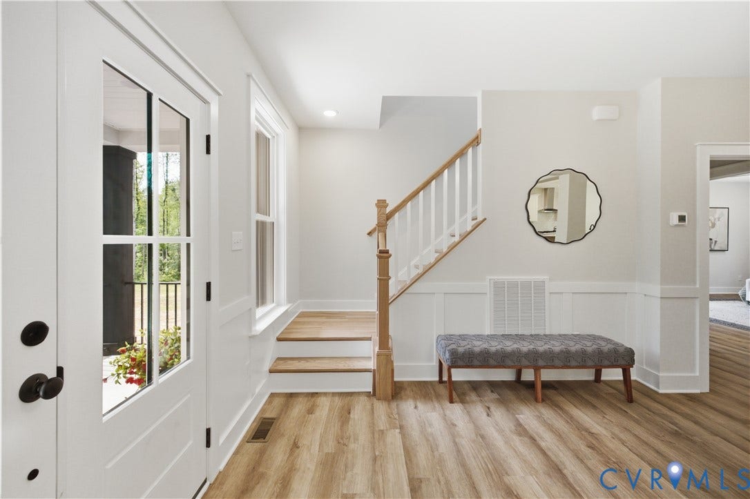 3120 Lake Stone (lot 22) Terrace, Maple Grove, Powhatan, VA 23139 Front door area, viewed from dining room. Photo of for-sale home, staged.