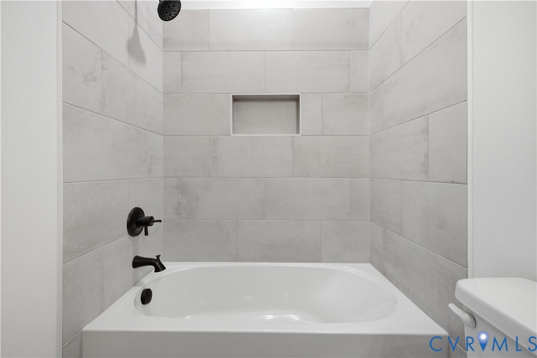 Shower in full bath for bed 2 and bed 3.