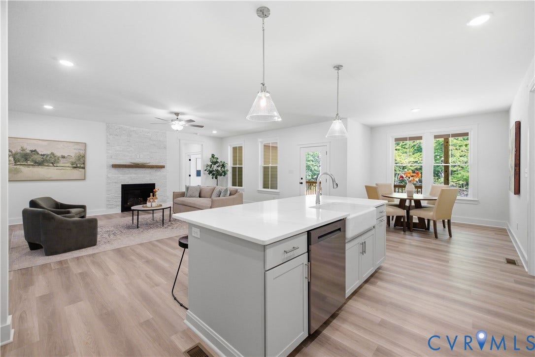 Views to the family room, dinette area from the kitchen. Photos of the for-sale home, staged.