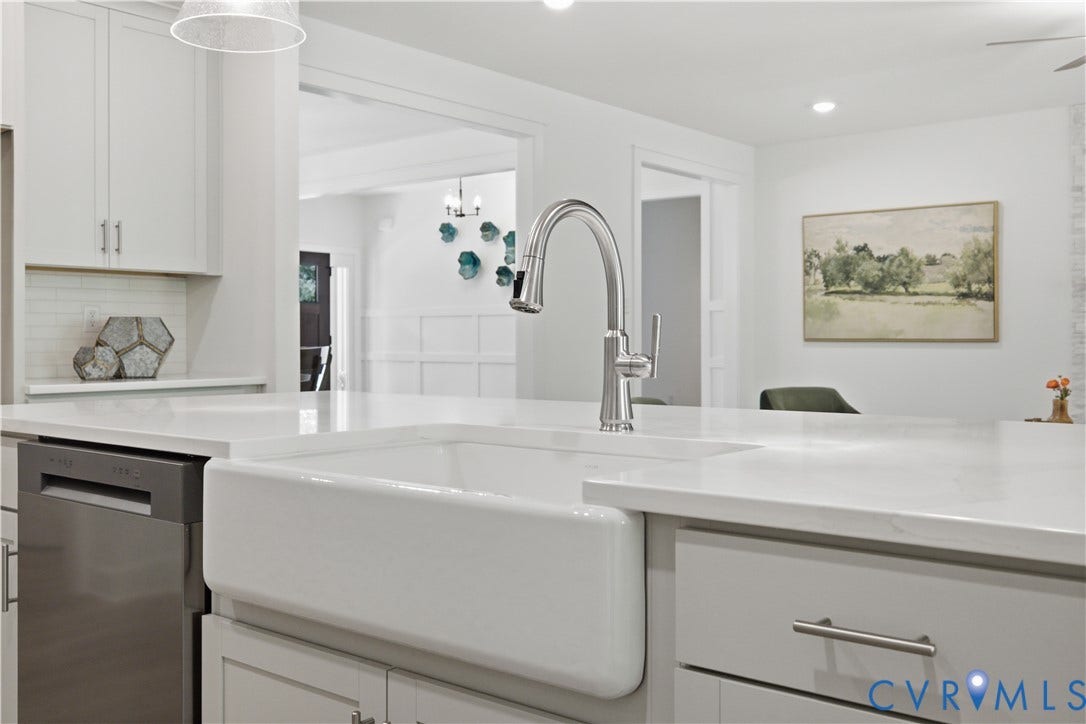 Farmhouse sink in the island. Photos of the for-sale home, staged.