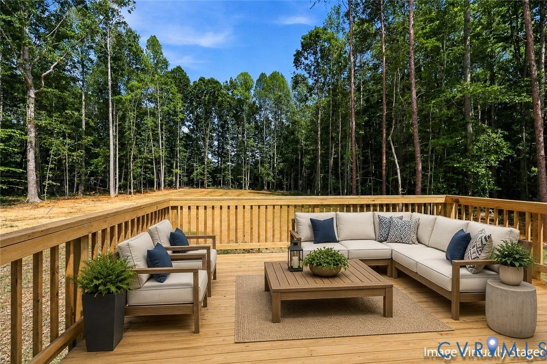 42 Clinton Farm Court, Clinton Farm, Cumberland, VA 23040 Expansive wood deck with natural wood railing, surrounded by mature trees