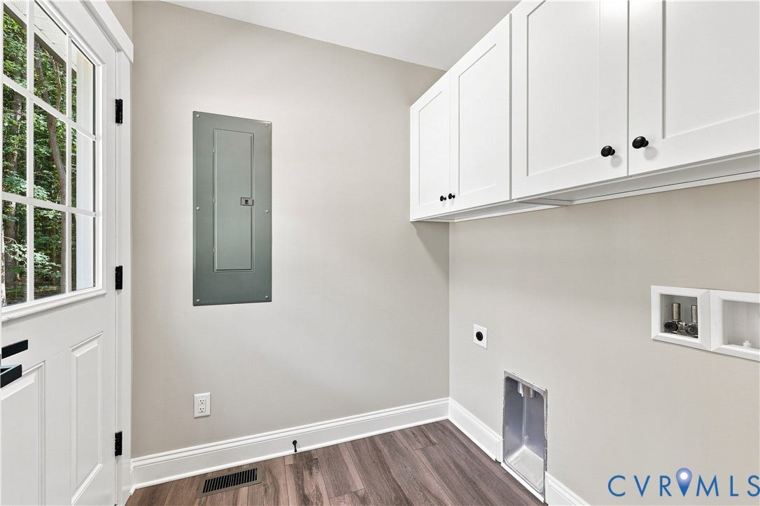 42 Clinton Farm Court, Clinton Farm, Cumberland, VA 23040 White shaker-style cabinetry, wood-finish flooring, and a windowed door