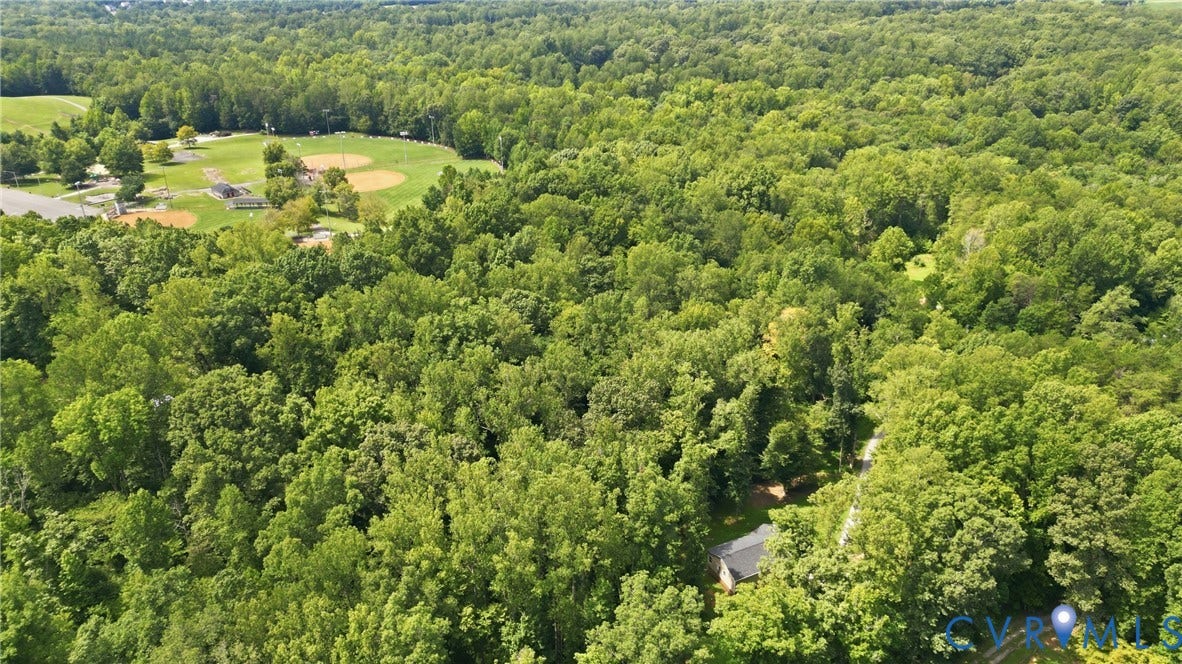 2575 Log Cabin Road, Maidens, VA 23102 Expansive wooded acreage with a nearby community recreational area featuring multiple baseball fields at Hidden Rock Park.