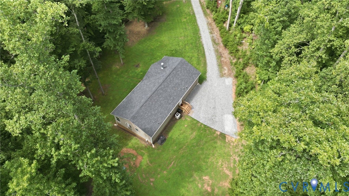2575 Log Cabin Road, Maidens, VA 23102 Gable roof with dark shingles, tan siding, and a wooden deck