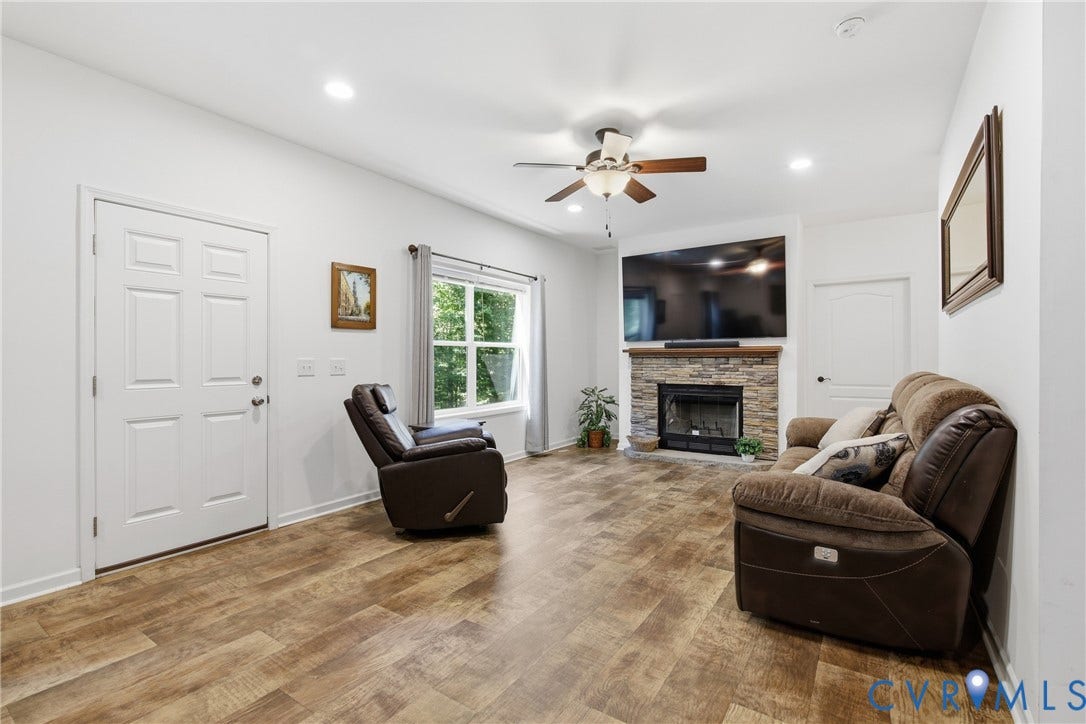 2575 Log Cabin Road, Maidens, VA 23102 Wood-finish flooring, recessed lighting, and a ceiling fan with integrated lighting