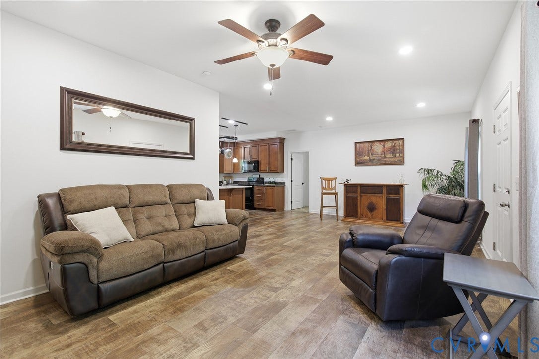 2575 Log Cabin Road, Maidens, VA 23102 Open-concept living area featuring wood-finish flooring, recessed lighting, and a ceiling fan