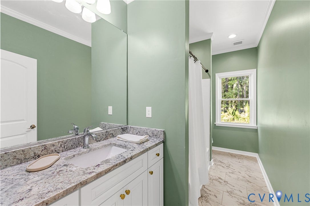 Hall bathroom, granite countertop vanity, tub and shower combo