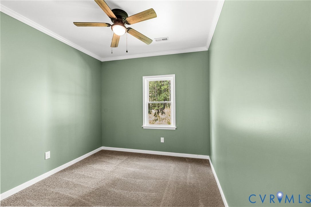 Neutral-toned carpeting, light , white crown molding, carpet, ceiling fan
