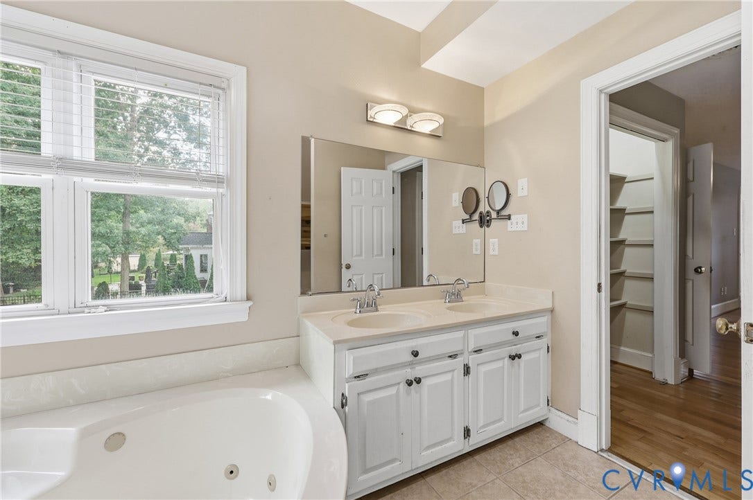 505 Martineau Drive, Chesterfield, VA 23836 Dual vanity with white cabinetry, light-toned countertop, and undermount sinks
