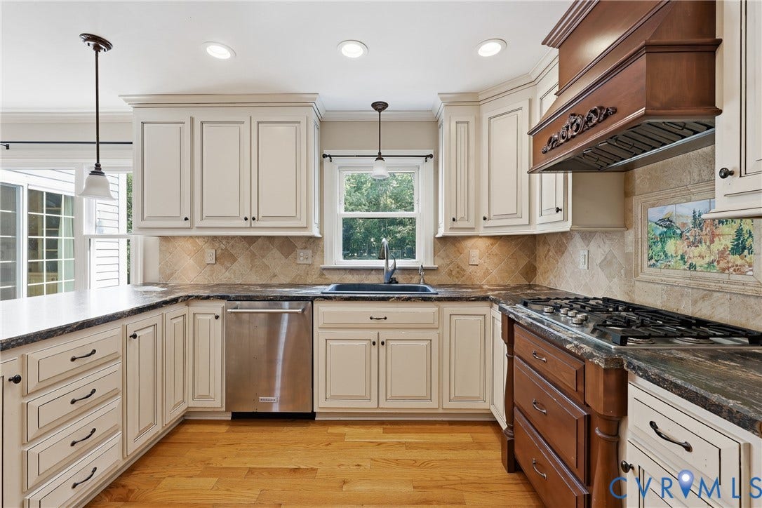 505 Martineau Drive, Chesterfield, VA 23836 Kitchen featuring white cabinetry, dark stone countertops, stainless steel appliances, a tile backsplash, and wood flooring