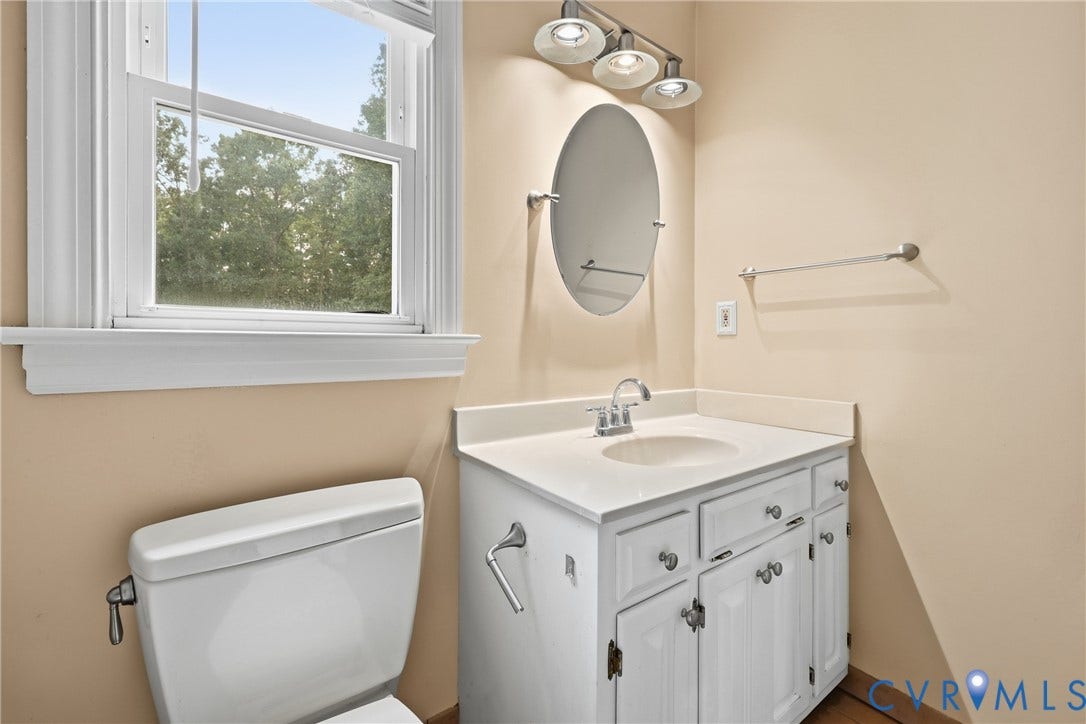 505 Martineau Drive, Chesterfield, VA 23836 White vanity with a neutral countertop, undermount sink, and brushed chrome faucet