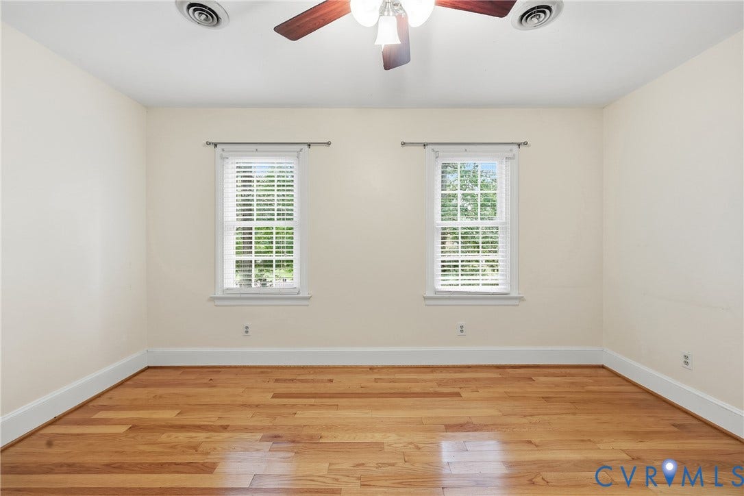 505 Martineau Drive, Chesterfield, VA 23836 Hardwood flooring throughout, two windows with blinds, ceiling fan with light fixture, and white trim