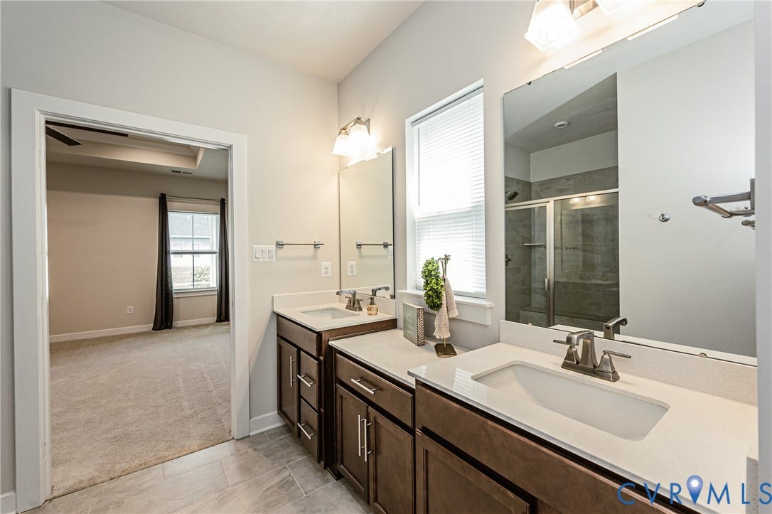 7683 Autumn Leaves Lane, Estates The Groves At New Kent, New Kent, VA 23124 Dual vanity with white countertops, undermount sinks, and brushed nickel fixtures