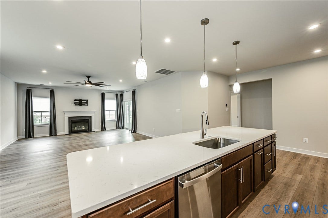 7683 Autumn Leaves Lane, Estates The Groves At New Kent, New Kent, VA 23124 Kitchen island with an undermount sink, gooseneck faucet, and integrated dishwasher