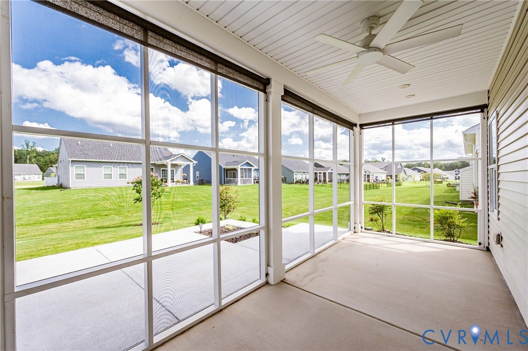 7683 Autumn Leaves Lane, Estates The Groves At New Kent, New Kent, VA 23124 Screened porch featuring a ceiling fan, recessed lighting, and concrete flooring