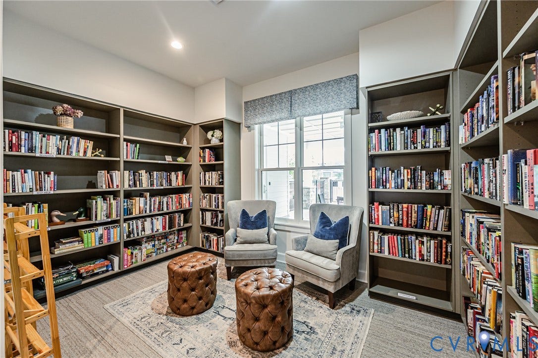 7683 Autumn Leaves Lane, Estates The Groves At New Kent, New Kent, VA 23124 Built-in shelving, patterned area rug, recessed lighting, and a large window with privacy valance