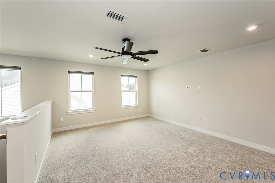 7683 Autumn Leaves Lane, Estates The Groves At New Kent, New Kent, VA 23124 Carpeted room featuring multiple windows, recessed lighting, and a ceiling fan