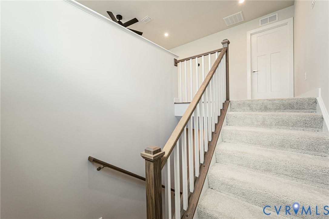 7683 Autumn Leaves Lane, Estates The Groves At New Kent, New Kent, VA 23124 Carpeted staircase with wood-finish handrail and white balusters