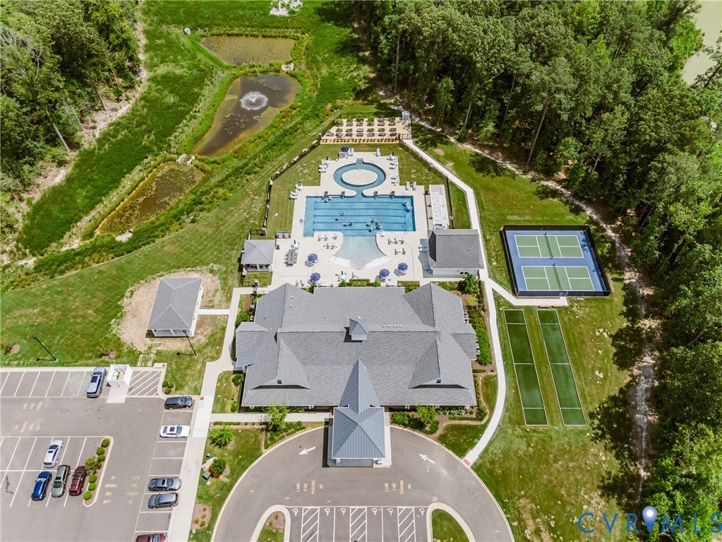7683 Autumn Leaves Lane, Estates The Groves At New Kent, New Kent, VA 23124 Expansive recreational area featuring a large swimming pool, circular spa, two tennis courts, and two bowling greens