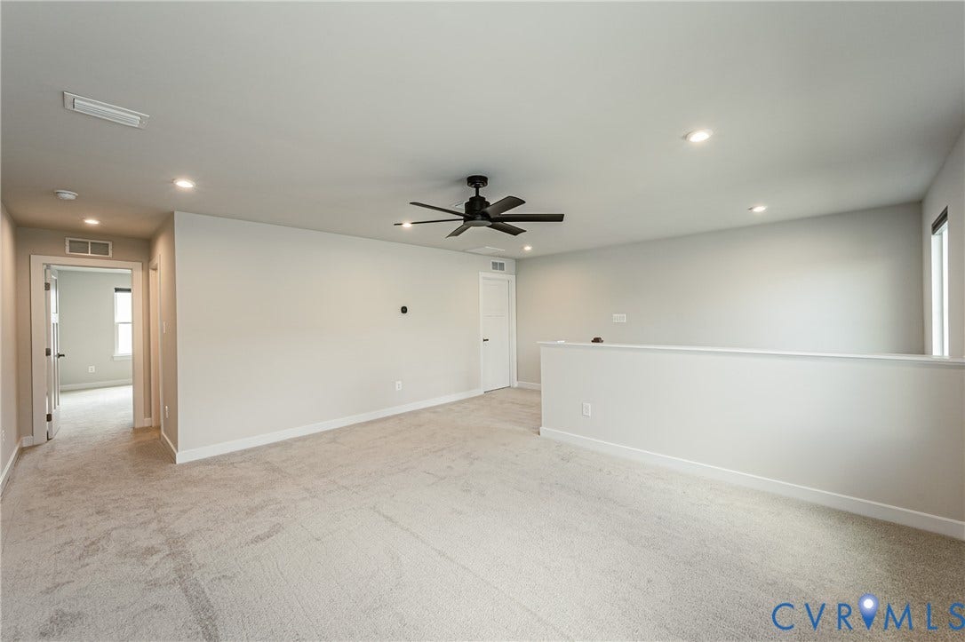 7683 Autumn Leaves Lane, Estates The Groves At New Kent, New Kent, VA 23124 Spacious room with plush carpeting, recessed lighting, and a ceiling fan