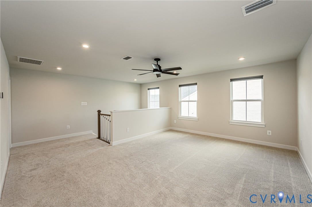 7683 Autumn Leaves Lane, Estates The Groves At New Kent, New Kent, VA 23124 Carpeted open-concept bonus room featuring recessed lighting, a ceiling fan, and multiple windows with blinds