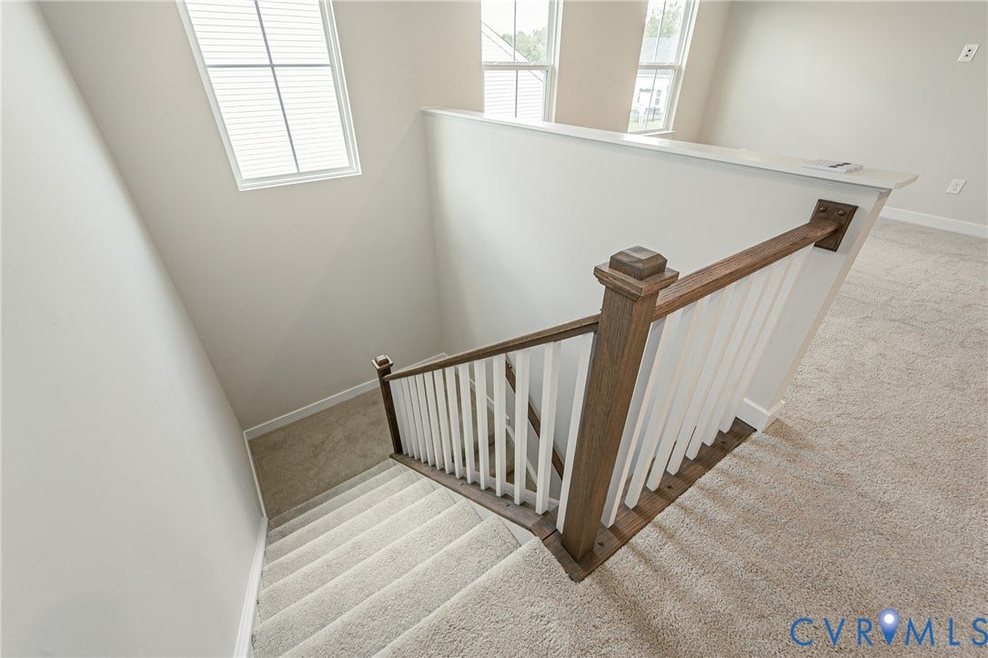 7683 Autumn Leaves Lane, Estates The Groves At New Kent, New Kent, VA 23124 Carpeted staircase with wood newel posts and white balusters