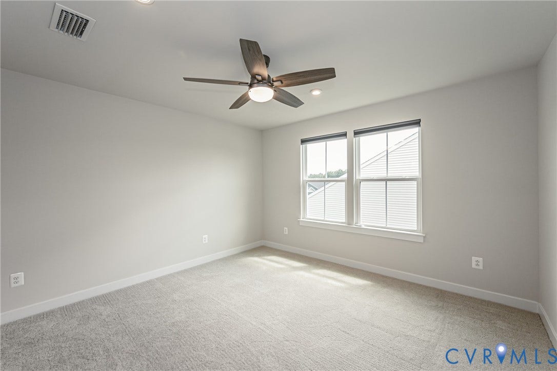 7683 Autumn Leaves Lane, Estates The Groves At New Kent, New Kent, VA 23124 Plush carpet flooring, recessed lighting, and a modern ceiling fan