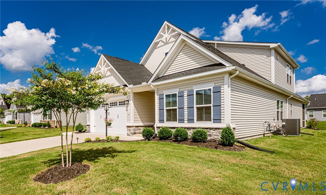7683 Autumn Leaves Lane, Estates The Groves At New Kent, New Kent, VA 23124 Exterior featuring light-colored siding, a dark shingle roof, and a stone facade