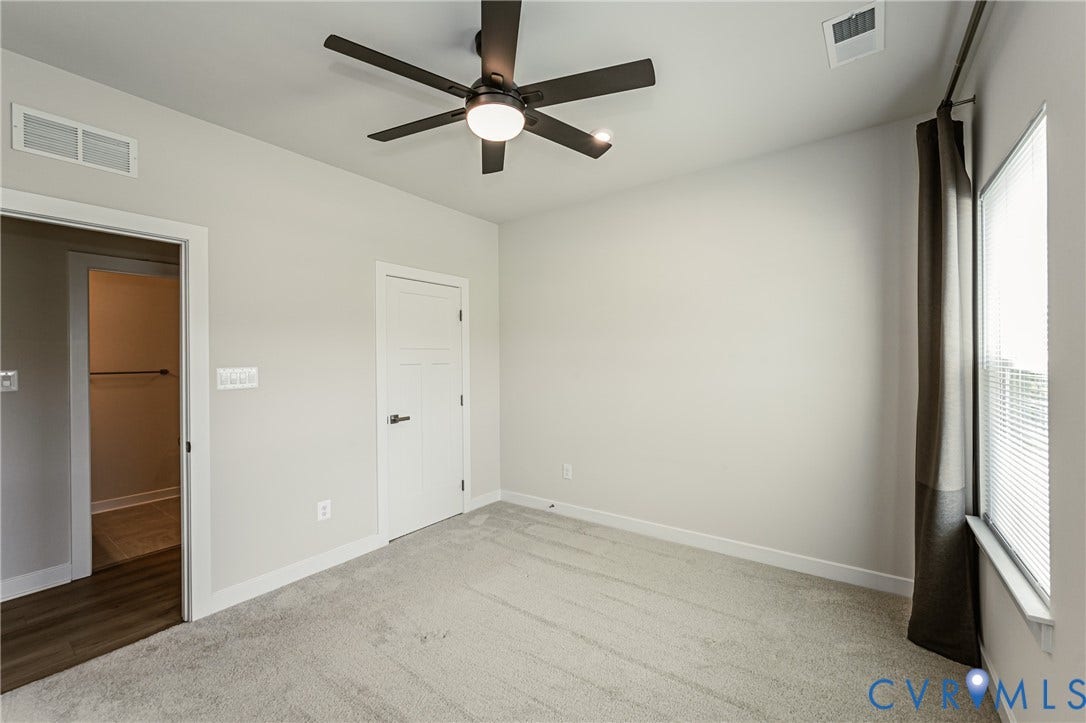 7683 Autumn Leaves Lane, Estates The Groves At New Kent, New Kent, VA 23124 Recessed lighting, ceiling fan with light fixture, light-toned carpeting, white trim, and a window with blinds