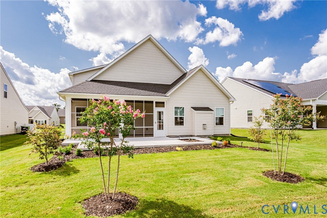 7683 Autumn Leaves Lane, Estates The Groves At New Kent, New Kent, VA 23124 Expansive backyard with a screened porch, concrete patio, and mature landscaping
