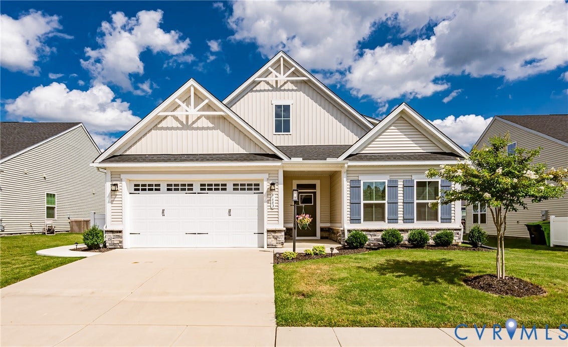 7683 Autumn Leaves Lane, Estates The Groves At New Kent, New Kent, VA 23124 Siding exterior with decorative gables, stone accents, and a concrete driveway
