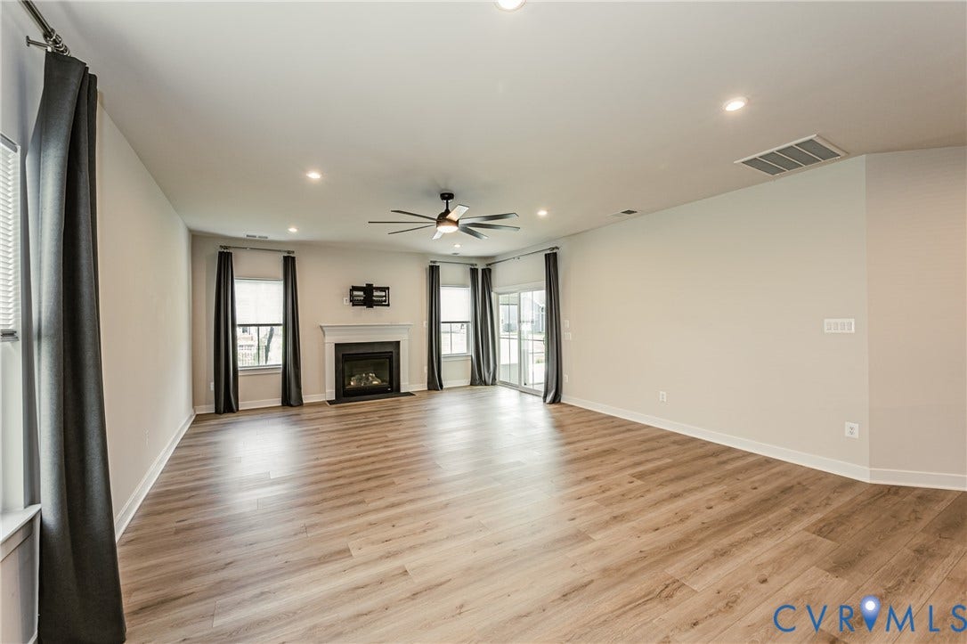 7683 Autumn Leaves Lane, Estates The Groves At New Kent, New Kent, VA 23124 Spacious room with wood-finish flooring, recessed lighting, and a ceiling fan