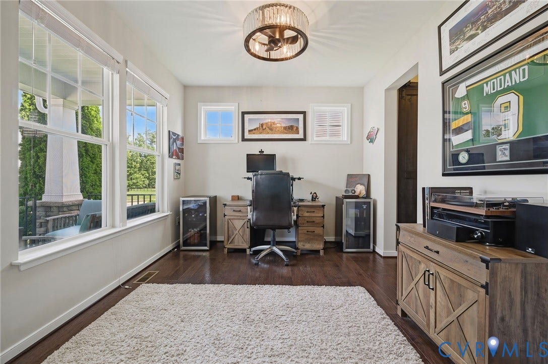 Hardwood flooring, recessed lighting, and ample natural light from multiple windows
