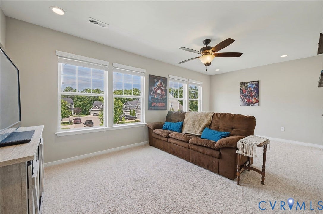 Recessed lighting, ceiling fan with light fixture, light neutral wall paint, white trim, and light carpeting
