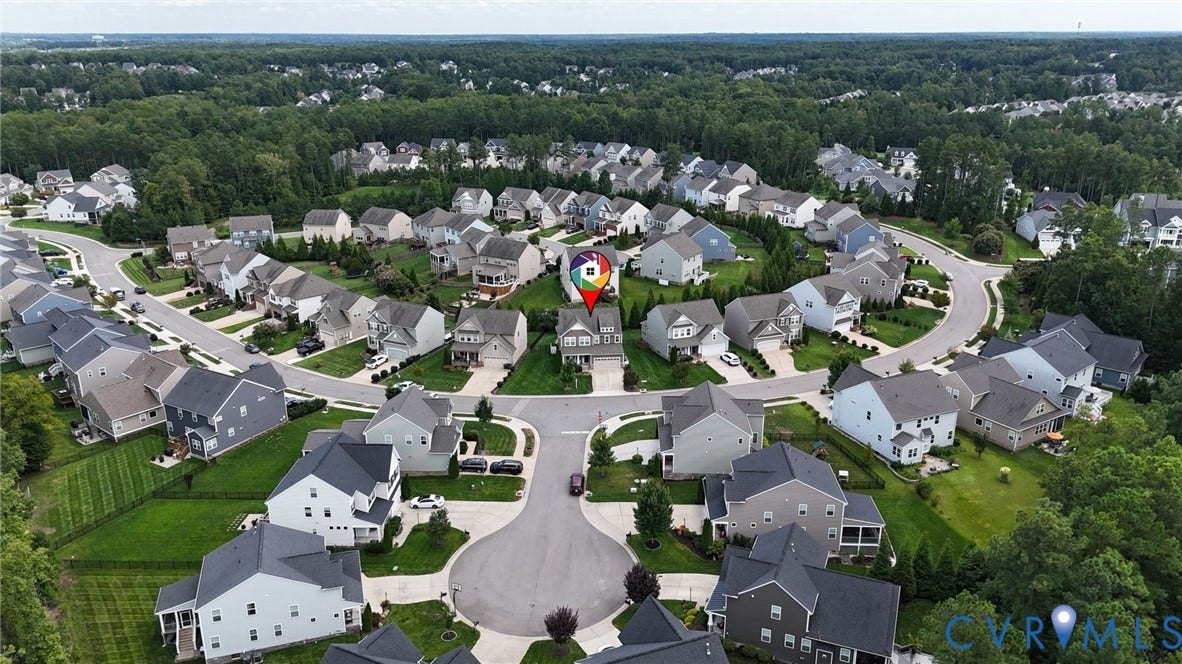 Residential neighborhood with cul-de-sac streets and mature perimeter landscaping
