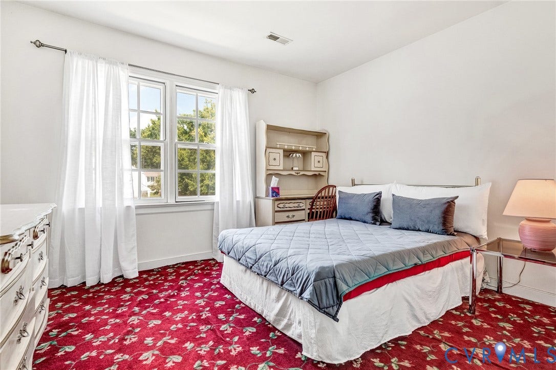 Window with white trim and white curtains