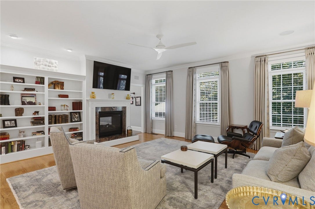 1921 Grey Oaks Park Lane, Glen Allen, VA 23059 Spacious entertaining space featuring built in's and a double sided gas fireplace.