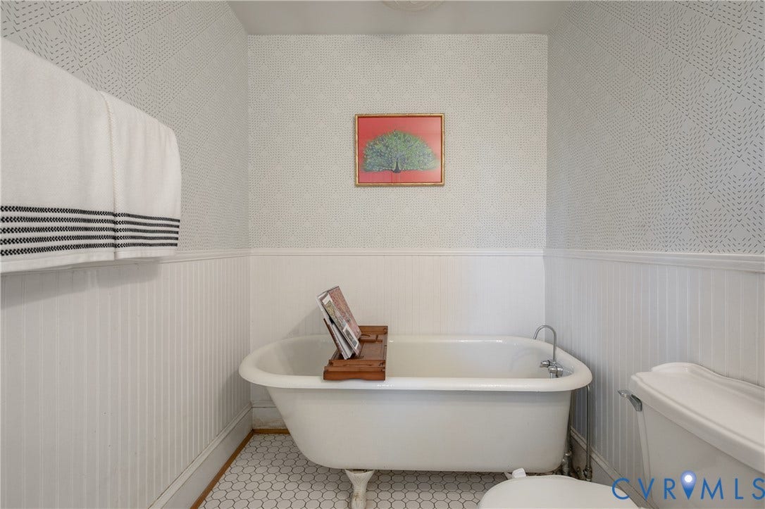 518 N 1st Street, Jackson Ward, Richmond, VA 23219 Classic clawfoot soaking tub with polished chrome fixtures and freestanding design
