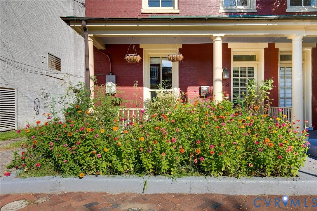518 N 1st Street, Jackson Ward, Richmond, VA 23219 Brick facade with a covered porch featuring white columns