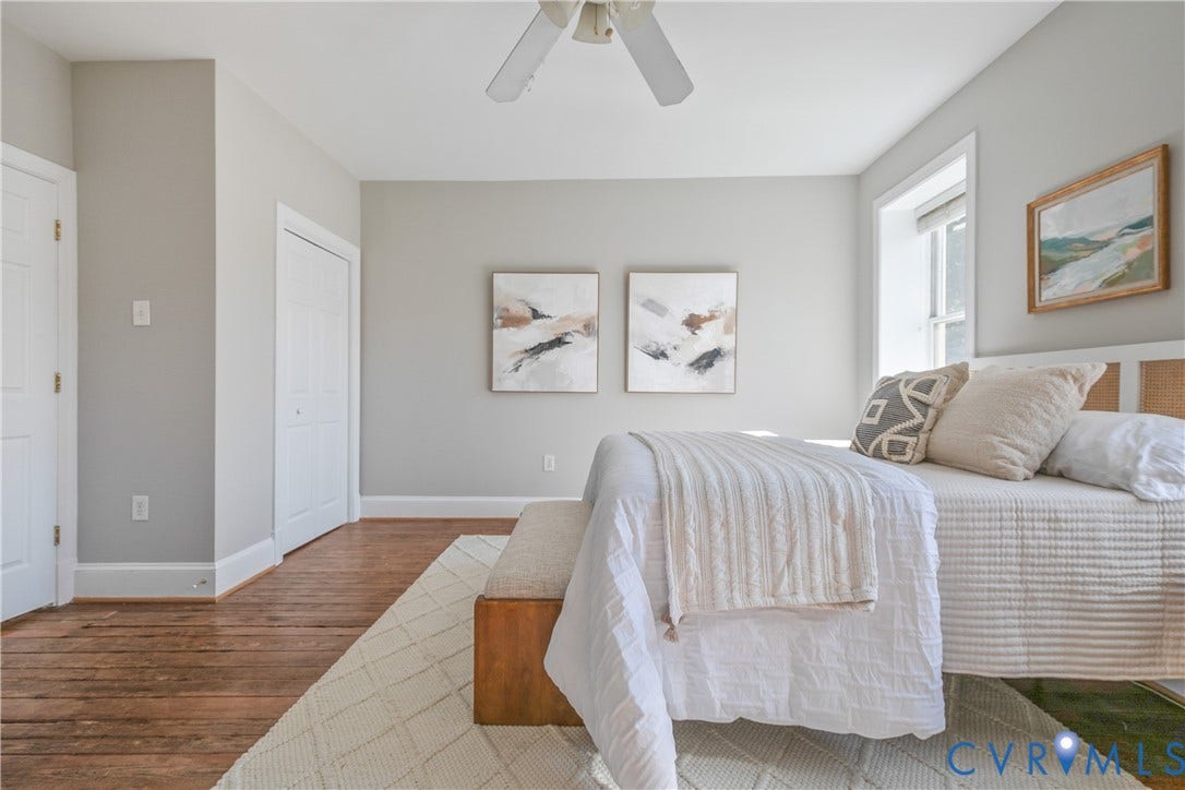 518 N 1st Street, Jackson Ward, Richmond, VA 23219 Hardwood flooring, painted walls, ceiling fan, white trim, and a window providing natural illumination