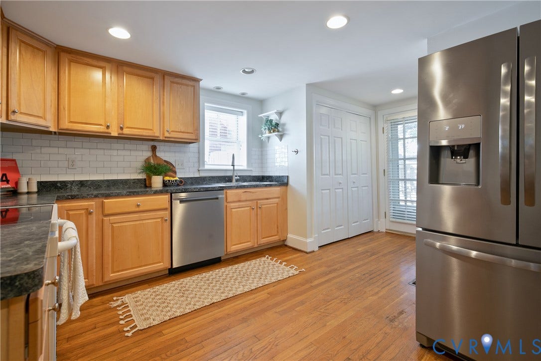 518 N 1st Street, Jackson Ward, Richmond, VA 23219 Kitchen with wood-finish flooring, recessed lighting, wood cabinetry, stone countertops, and a subway tile backsplash