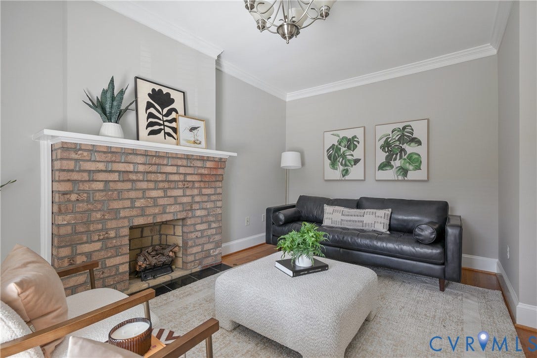 518 N 1st Street, Jackson Ward, Richmond, VA 23219 Brick fireplace with a white mantel, complemented by crown molding and light gray wall tones