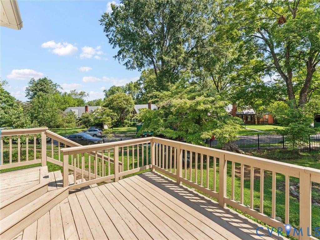 Expansive wood deck with railings and steps