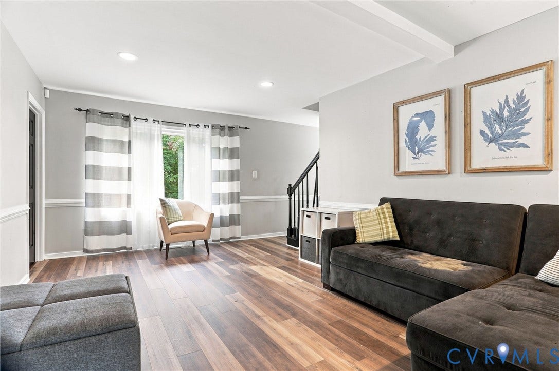 Wood-finish flooring throughout, recessed lighting, and crown molding