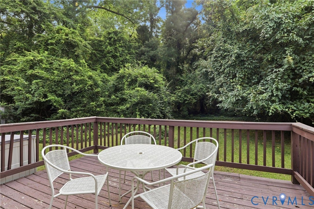 Outdoor deck with wood-finish flooring and railing