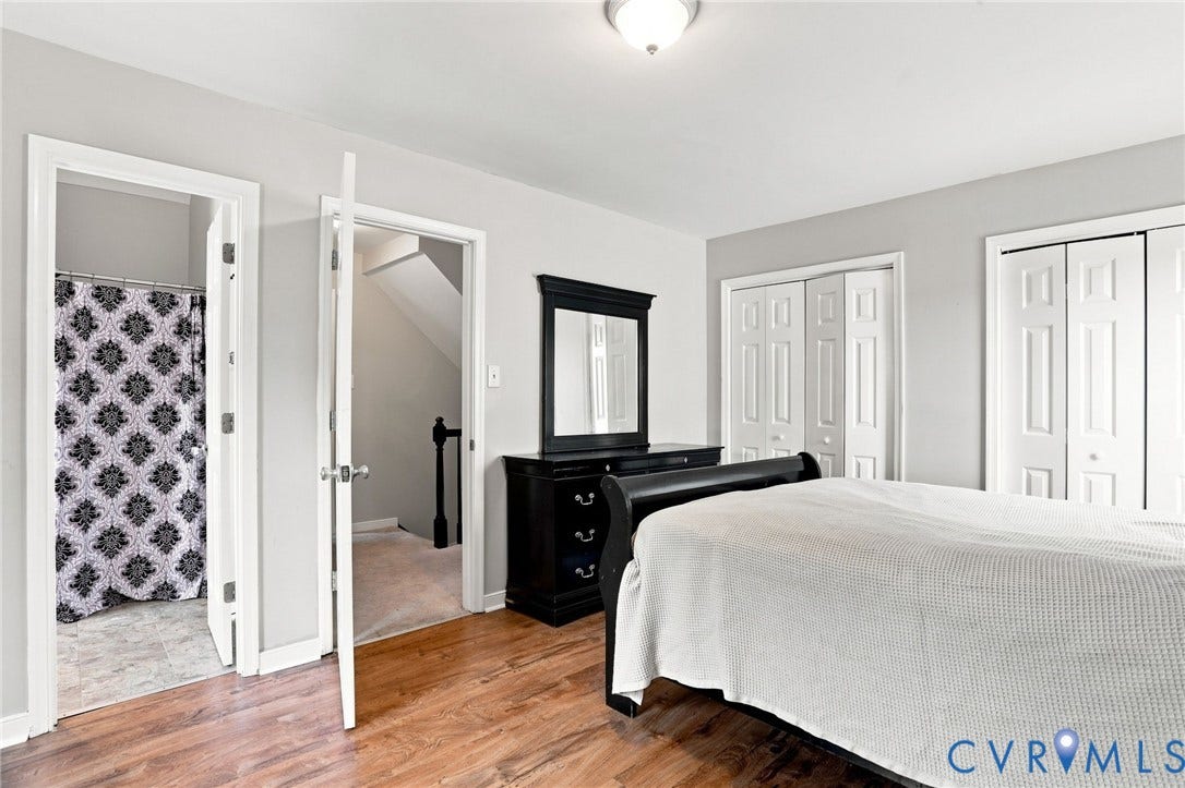 Wood-finish flooring with light gray wall paint