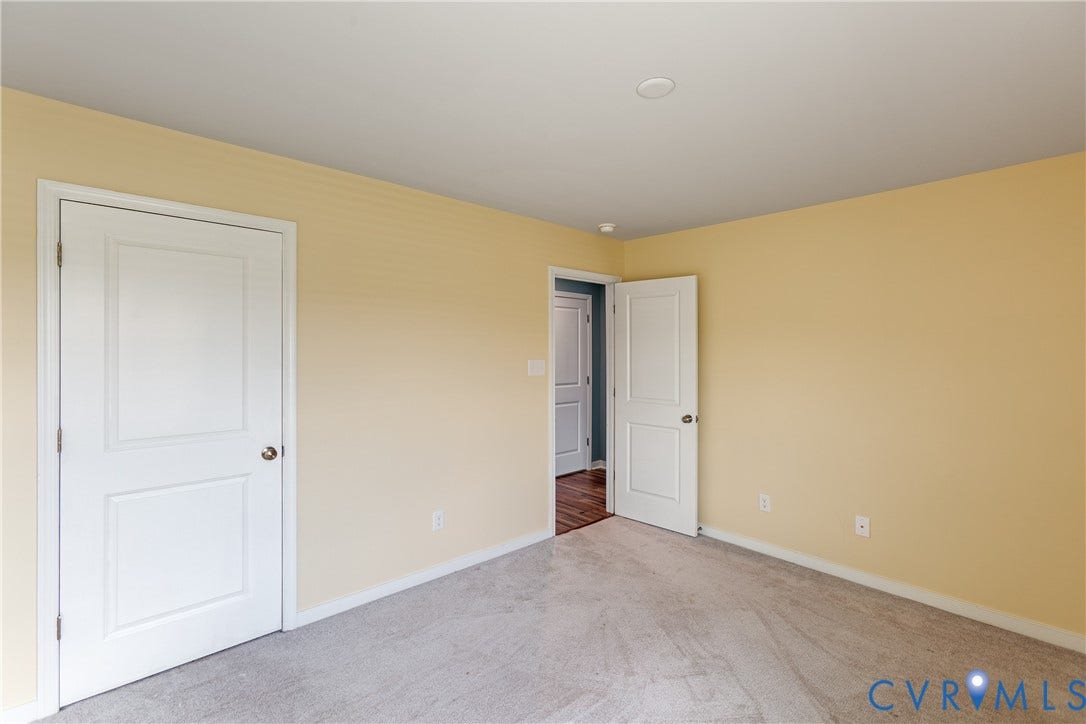 11419 Dunmore Mill Court, Chester, VA 23831 Neutral tone wall paint, light gray carpeting, recessed ceiling lighting, and crisp white trim