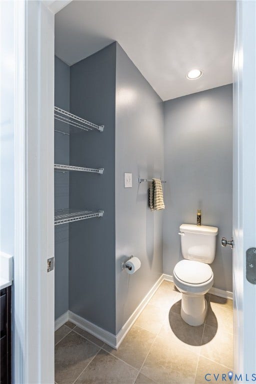 11419 Dunmore Mill Court, Chester, VA 23831 Recessed lighting illuminates the tiled flooring and white toilet